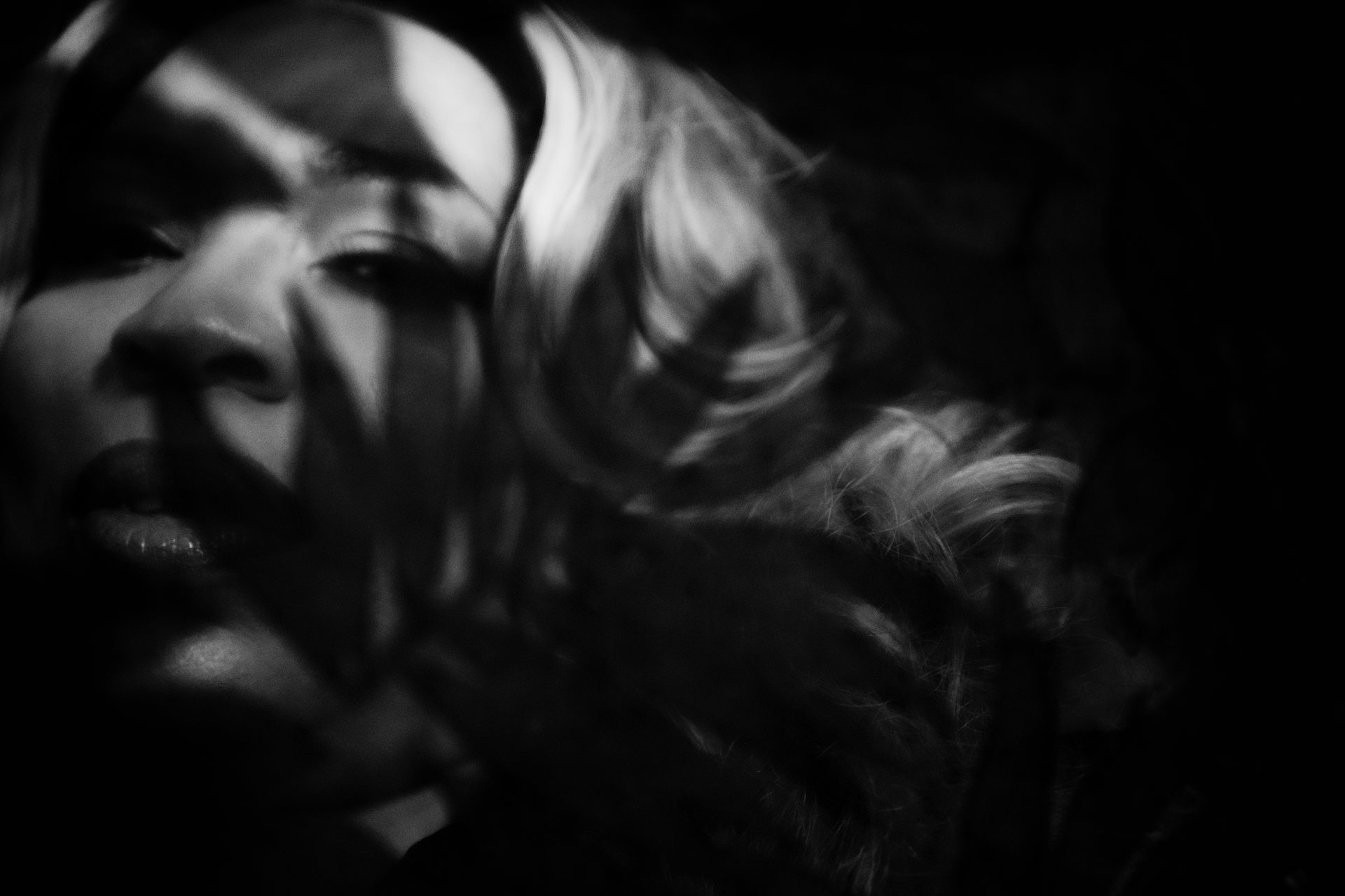 artisti boudoir bw mysterious picture of woman peeking through plants leaves kzoo kalamazoo photo studio